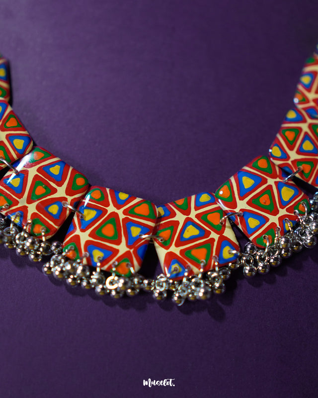 Bandhani handmade necklace, elegantly displayed against a subtle backdrop, with intricate Bandhani patterns and vibrant colors that bring out its traditional allure and graceful design — Muselot.