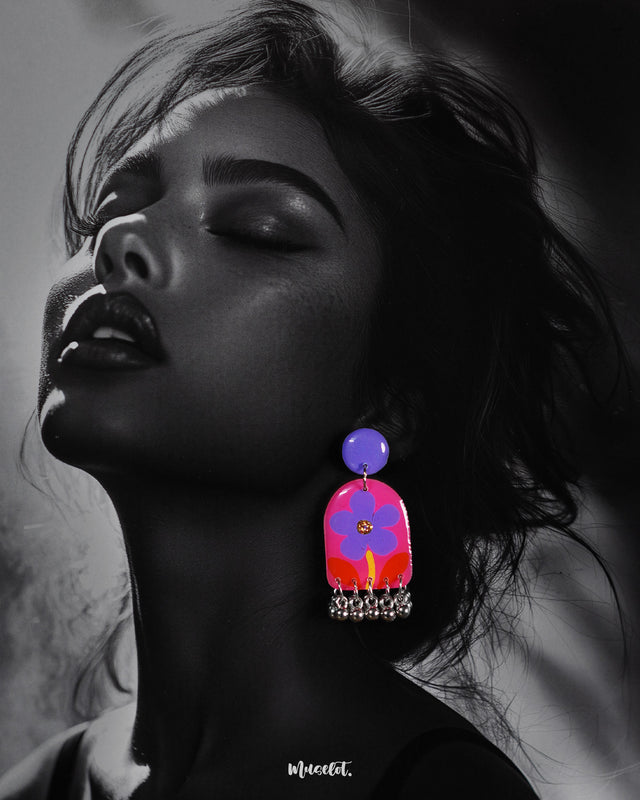 Benazir handmade floral drop earrings worn by the model, featuring intricate floral detailing in warm tones with a graceful dangling design that adds an artisanal touch to the overall look — Muselot