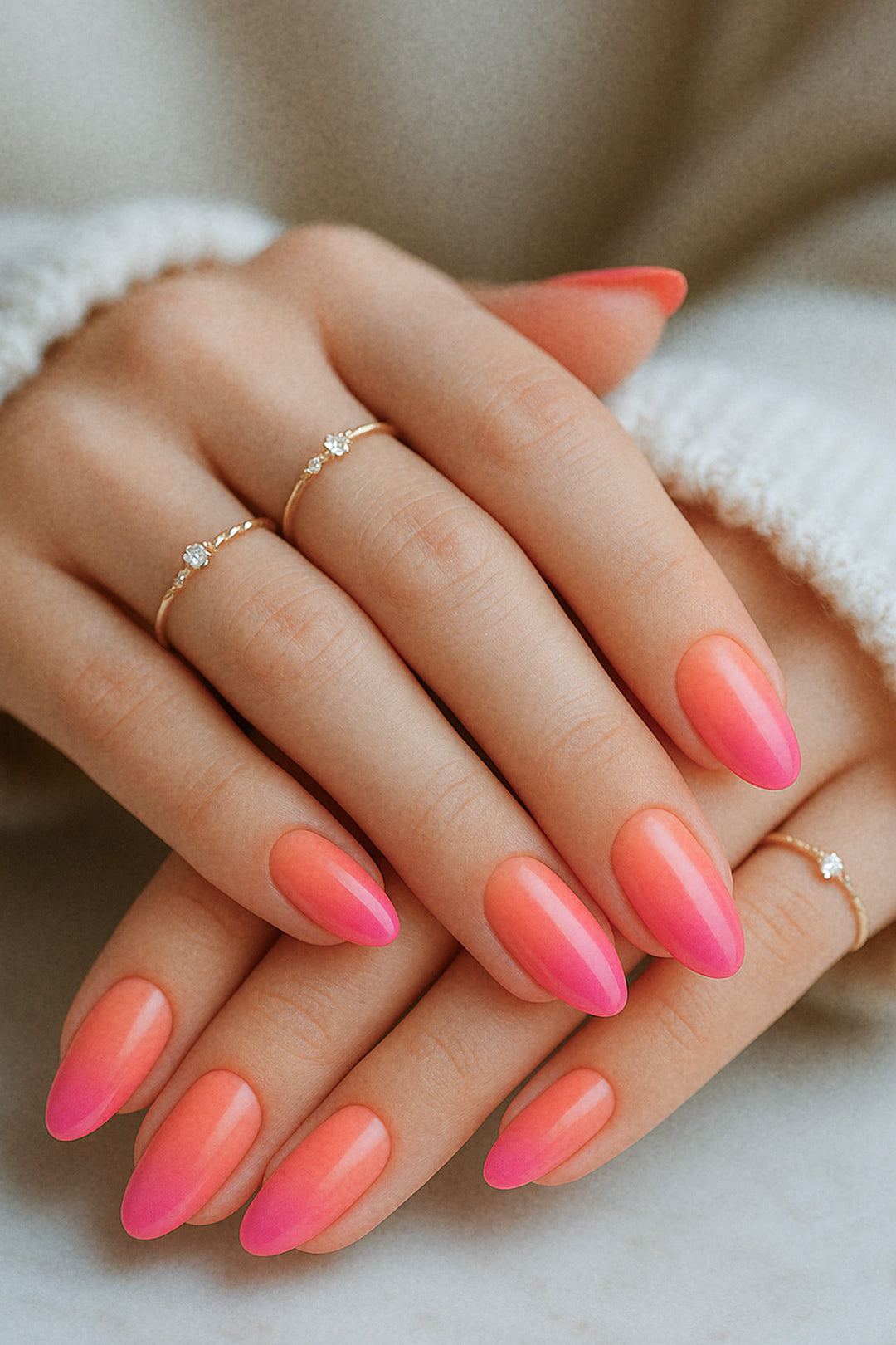 A styled shot of a model’s hands wearing Berry Bliss Ombre nail stickies, showcasing the seamless gradient blending from coral-pink to a rich berry tone across all nails, highlighting the elegance of coordinated ombre nail art with a glossy, salon-like finish – Muselot.