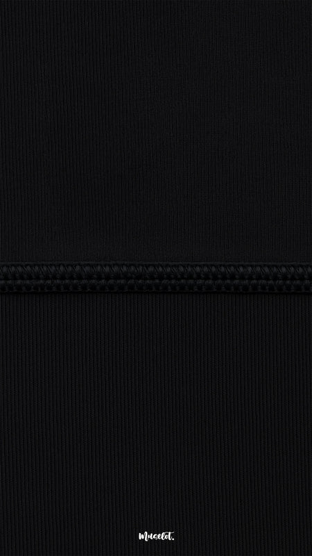 Macro close-up of black semi-opaque breathable tights with reinforced seam, showing fine ribbed texture, strength, and high-quality finish - Muselot