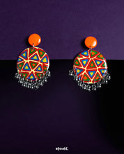 Chakardi traditional art earrings, set against a soft backdrop, showcasing intricate designs inspired by traditional craftsmanship, blending heritage with elegance for a timeless look — Muselot.