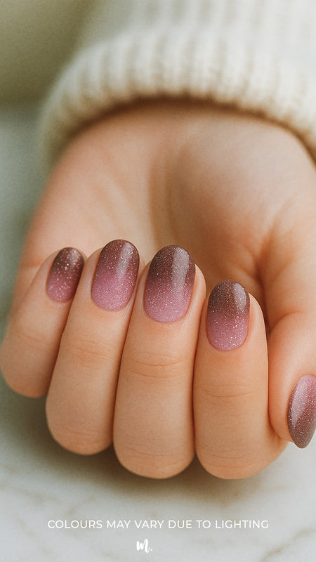 A model hand styled with Choco Plum Ombre nail art stickies, showcasing the flawless transition from soft plum at the base to deep chocolate brown at the tip, highlighted with glitter for a radiant ombre finish that looks elegant, chic, and salon-ready – Muselot.