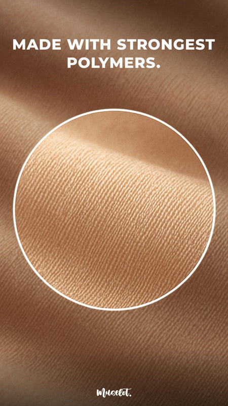 Close-up of premium stocking fabric in nude tone, zoomed-in through a circular magnifier to highlight its fine weave and texture. The image features the caption "Made with strongest polymers" at the top.