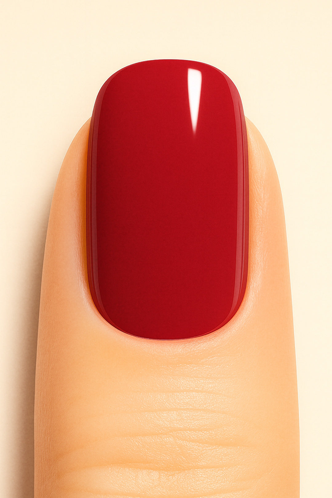 A close-up shot of a model’s finger wearing Crimson Kiss Solid Nail Stickies, showcasing a deep, bold crimson red shade with a smooth glossy finish, highlighting the rich solid color and sleek shine of the nail art – Muselot.