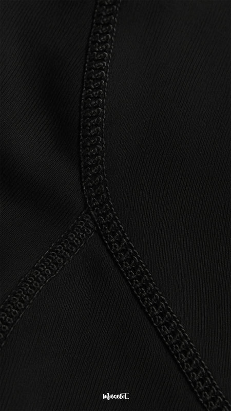 Close-up of comfortable opaque black stockings with reinforced seam, highlighting premium stitching, durability, and smooth fabric texture - Muselot