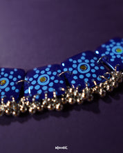 Close-up view of the Falakzaar blue floral necklace, highlighting the intricate hand-painted detailing and showcasing the delicate craftsmanship and graceful design — Muselot.