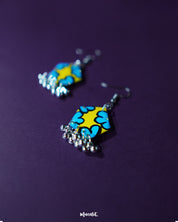 A zoomed-in view of the Gulaftab hook earrings, highlighting the detailed yellow and blue floral design with soft brush strokes, showcasing the finesse of handcrafted artistry — Muselot.
