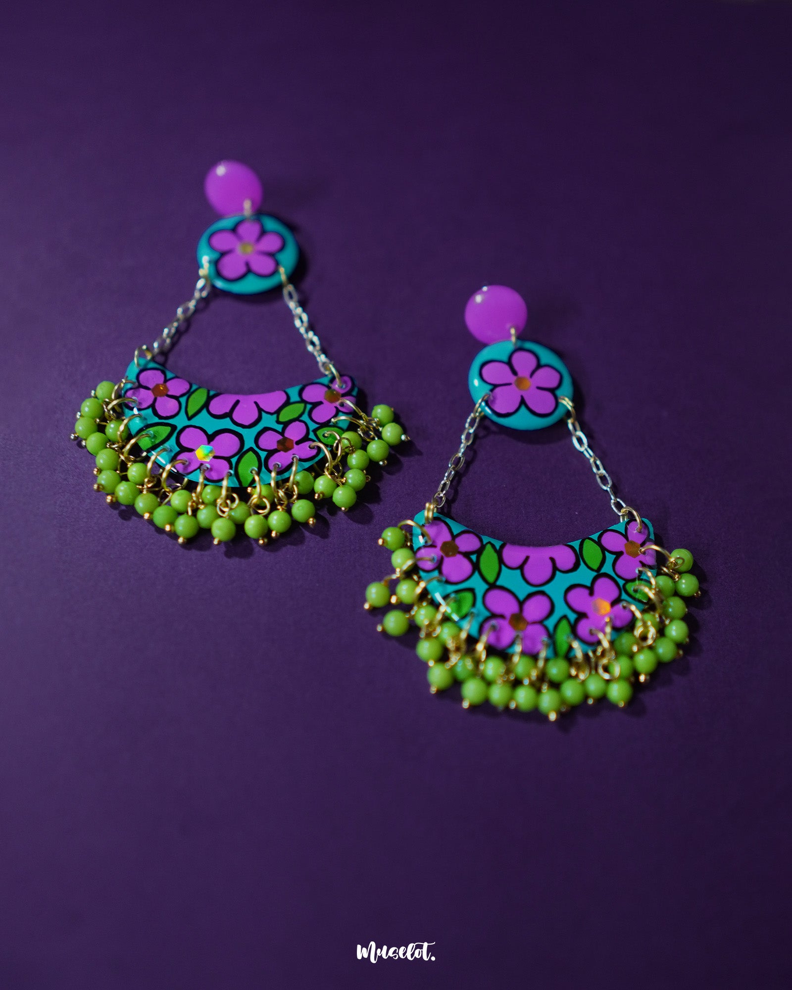 Gulbahaar chandbali earrings with vivid purple and green floral hand-painted patterns, finished with dangling yellow beads, highlighting their bold handcrafted appeal — Muselot.