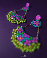 Close-up of Gulbahaar chandbali earrings, highlighting the intricate floral artwork and detailed beaded edge that adds a traditional yet elegant touch — Muselot.