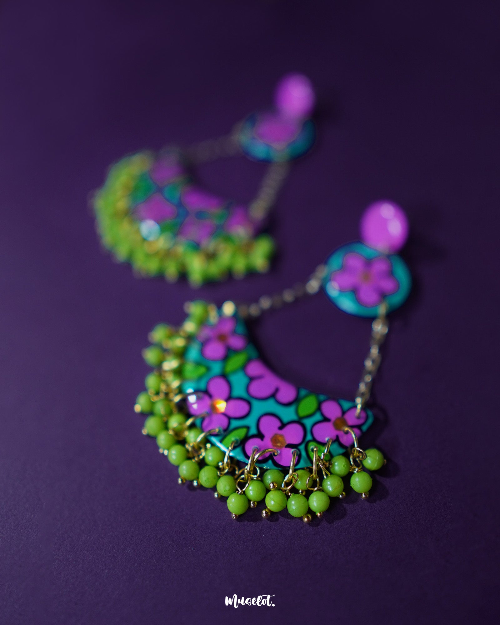 Zoomed-in front view of the Gulbahaar chandbali earrings featuring detailed floral patterns with pearl-like accents, highlighting intricate artistry and showcasing graceful ethnic elegance — Muselot.