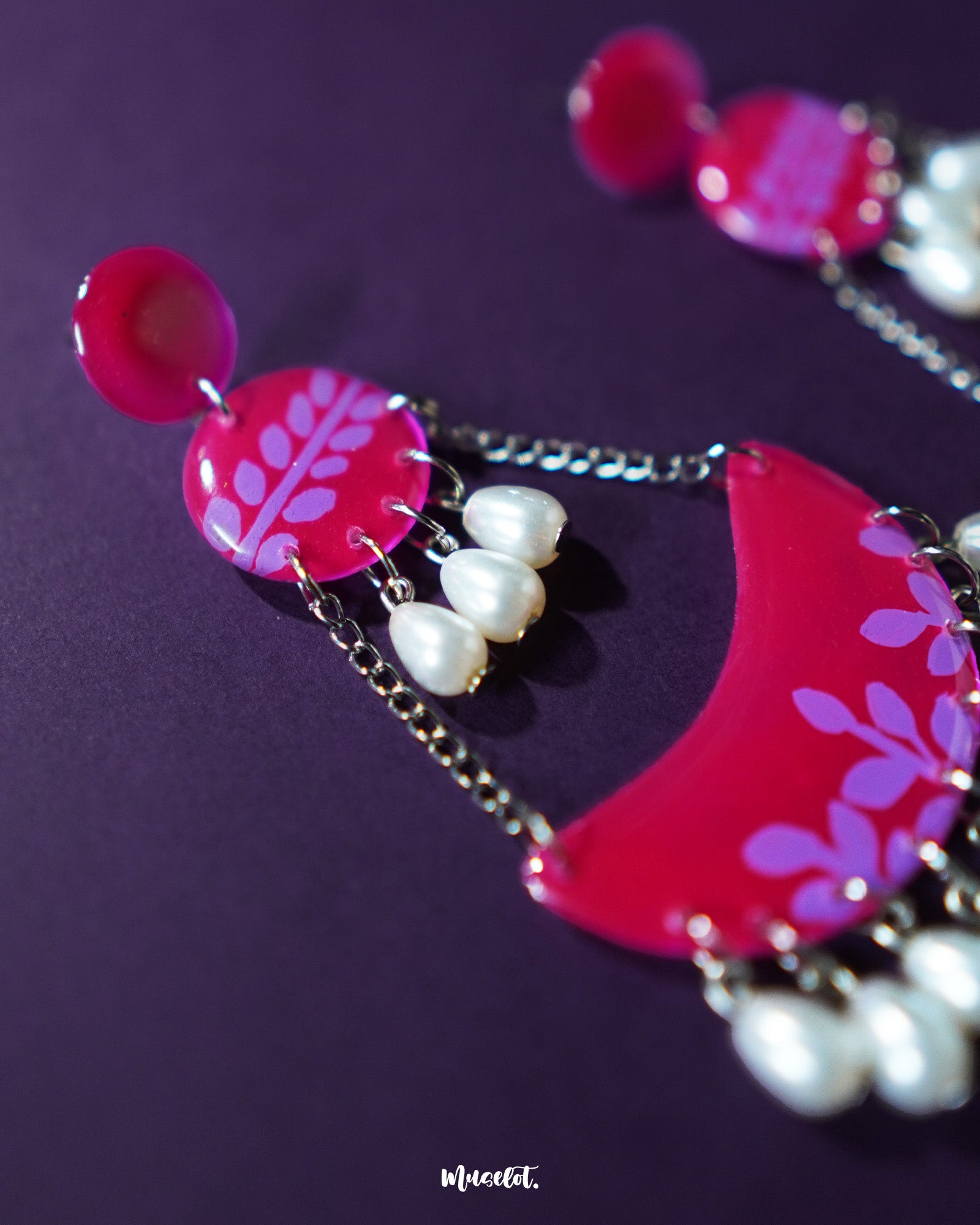 A slightly angled view of the Gulfaam pink pearl chandbali earrings showcases the cascading design and layered detailing, with soft pink pearls lending a touch of grace and feminine charm — Muselot.