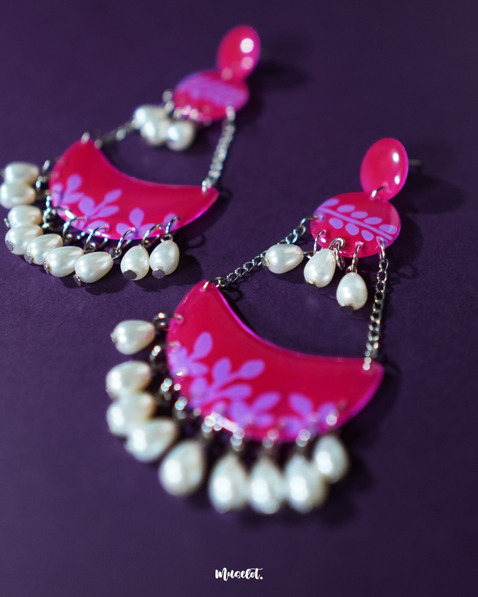 A close view of the Gulfaam pink pearl chandbali earrings captures their refined craftsmanship, with delicate pearl accents enhancing the intricate detailing of the crescent design — Muselot.