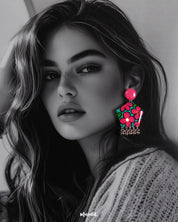 Close-up shot of a model wearing Gulshafa floral stud earrings, showcasing delicate floral details and earthy tones that add a touch of bohemian elegance to the overall look — Muselot.