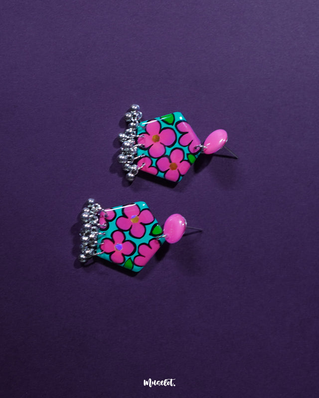 Gulshafa pink floral drop earrings, set against a soft backdrop, with vibrant pink hues and delicate floral details that highlight their playful yet elegant boho charm — Muselot.