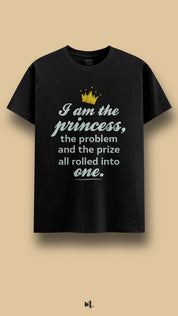 Black graphic t-shirt showcasing the “I Am the Princess, the Problem and the Prize All Rolled Into One” statement, highlighting confidence, sass, and unapologetic main-character energy against a clean beige background – Muselot
