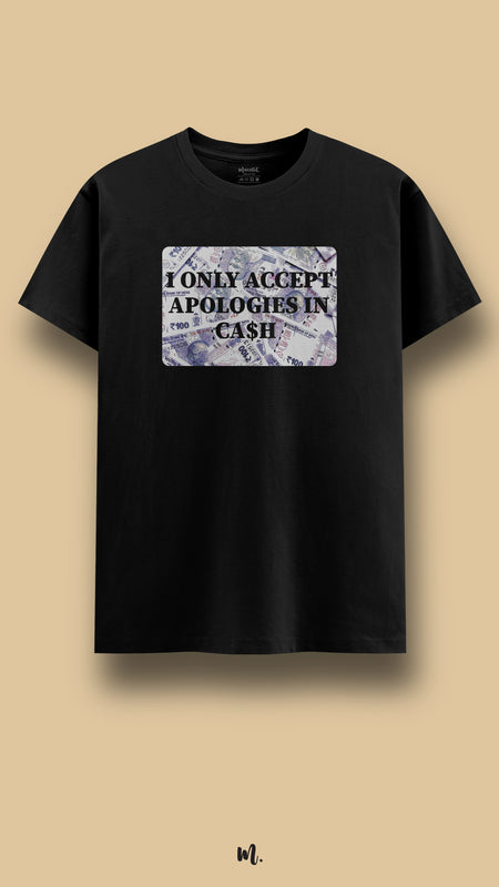 Black graphic t-shirt showcasing the “I Only Accept Apologies in Cash” statement, highlighting a cheeky, savage, and confident attitude against a clean beige background – Muselot