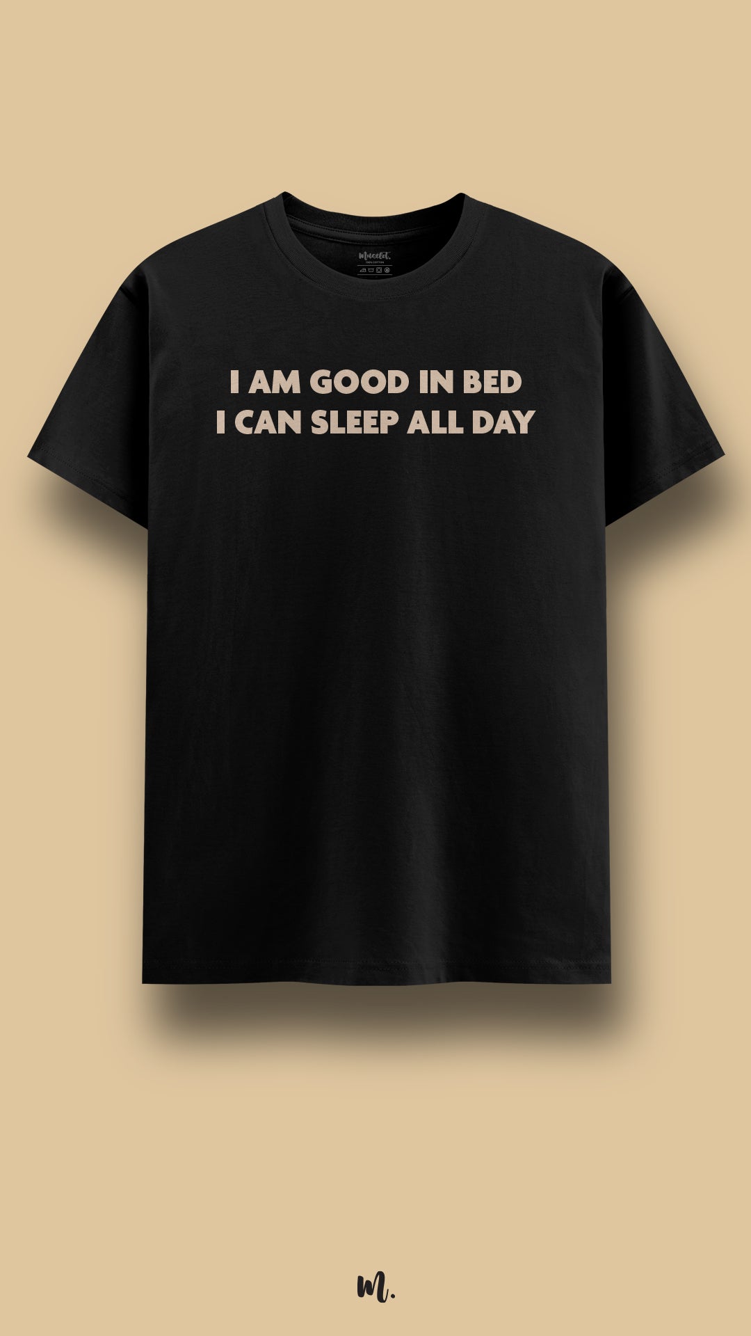 Black graphic t-shirt showcasing the “I Am Good in Bed I Can Sleep All Day” statement, highlighting a playful, witty, and laid-back personality against a clean beige background – Muselot