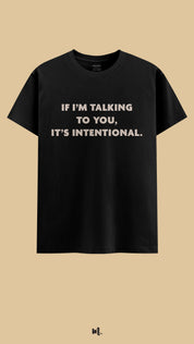 Black graphic t-shirt showcasing the “If I’m Talking to You, It’s Intentional.” statement, highlighting a bold, self-assured vibe against a clean, minimal beige background – Muselot