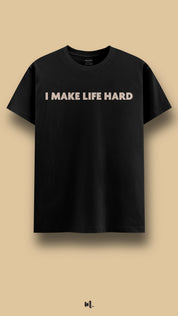 Black graphic t-shirt showcasing the “I Make Life Hard” statement, highlighting a bold, dominant, and playful attitude against a clean beige background – Muselot