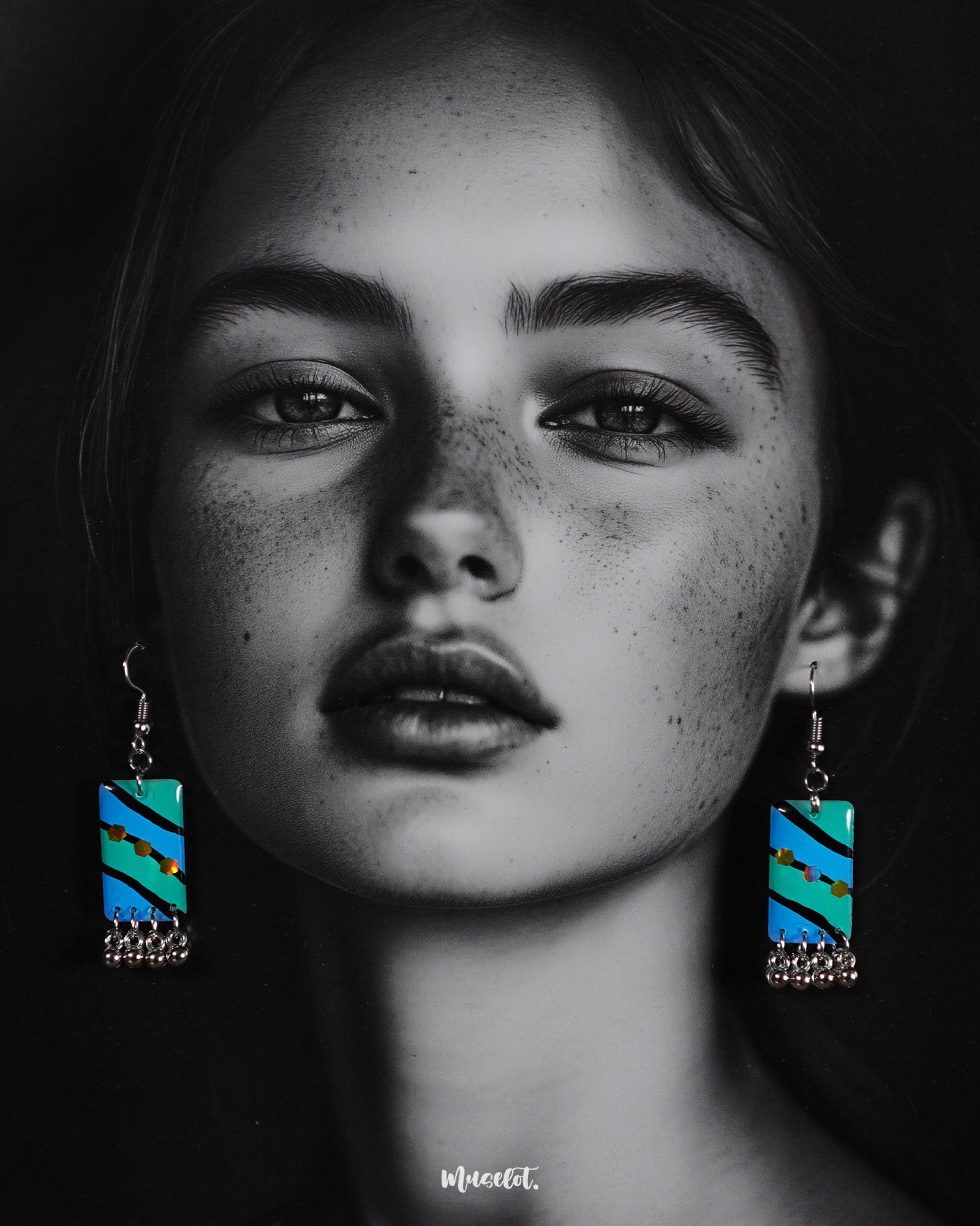 A woman wearing the Jaltarang boho drop earrings, their fluid, layered design and ocean-inspired hues adding a touch of wanderlust charm to her look—Muselot.