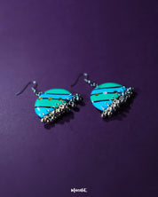 A pair of Jaltarang strip earrings rests gracefully, showcasing their sleek with fine detailing and artistic simplicity—Muselot.