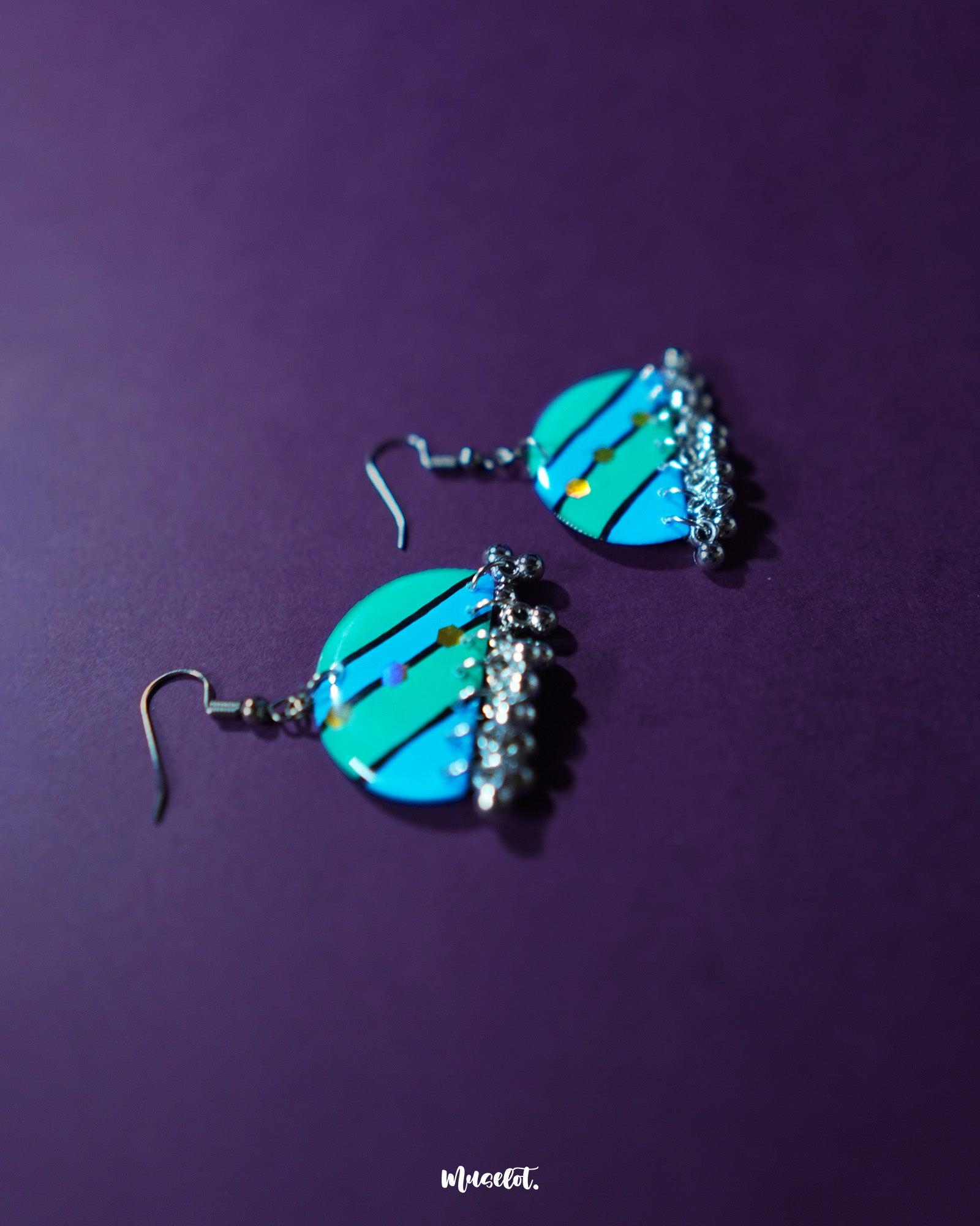 the Jaltarang strip earrings shows their linear design and sleek, metallic finish, perfect for a modern and elegant look—Muselot.