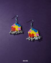 A pair of Jharokhe multicolor floral hook earrings displayed front-facing, showcasing their hand-painted floral design in vivid red, yellow, and blue tones, accented with tiny silver ghungroos — Muselot