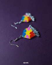 A single Jharokhe multicolor floral hook earring photographed at an angle, highlighting the intricate flower pattern and delicate ghungroo detailing that adds a playful boho touch — Muselot.