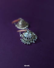 Pair of Kumudini pink lotus jhumkas displayed together, showcasing symmetrical floral domes and detailed craftsmanship on a clean backdrop – Muselot.