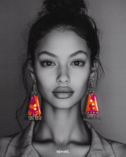 A model wearing the Laalsavera drop earrings, showcasing the rich red tones and intricate detailing that lend an elegant flair to the look, making a bold yet graceful statement – Muselot