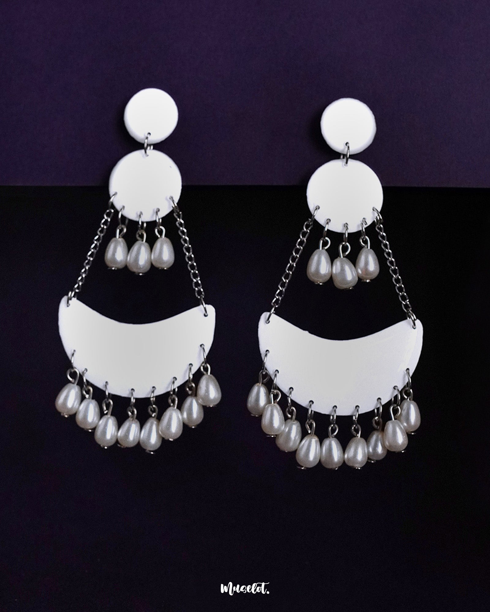 Mahtab jhumkas featuring a white crescent-shaped design with hanging pearl drops and silver chains, showcasing a blend of minimal elegance and timeless charm — Muselot.
