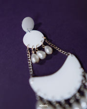 Close-up of Mahtab pearl chandbali earrings revealing intricate detailing of glossy white enamel and delicately suspended teardrop pearls, showcasing timeless charm and refined craftsmanship — Muselot.