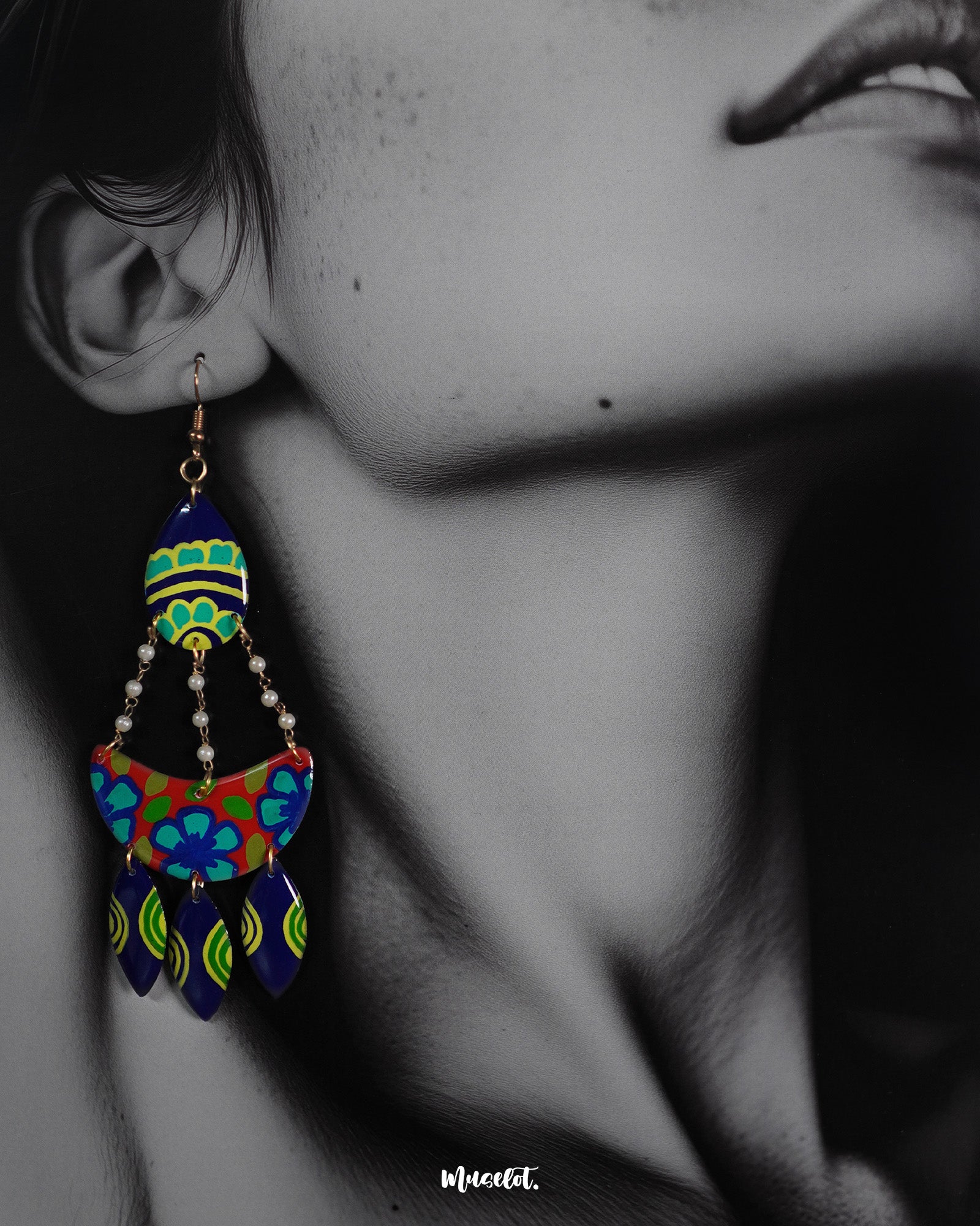 Close-up shot of a model wearing Mayoori chandbali earrings, featuring delicate detailing and a traditional design that enhance the elegance of the overall look with a timeless, sophisticated touch — Muselot.