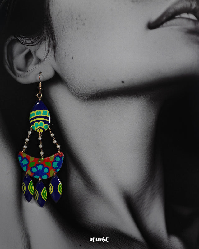 Close-up shot of a model wearing Mayoori chandbali earrings, featuring delicate detailing and a traditional design that enhance the elegance of the overall look with a timeless, sophisticated touch — Muselot.