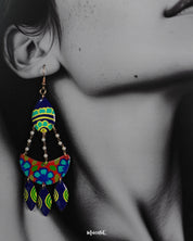 A model wearing Mayoori chandbali earrings, with intricate patterns and bold design elements that bring out their regal charm and timeless elegance — Muselot.