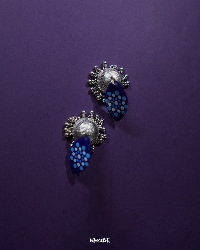 Meghmalhar boho jhumkas in focus, showcasing their lightweight dome design paired with colorful floral details, highlighting handcrafted elegance and playful vibrance — Muselot.