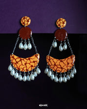 Mittika chandbali earrings featuring earthy tones and abstract crackle patterns, finished with delicate pearl drops — a bold yet graceful piece for statement styling — Muselot.
