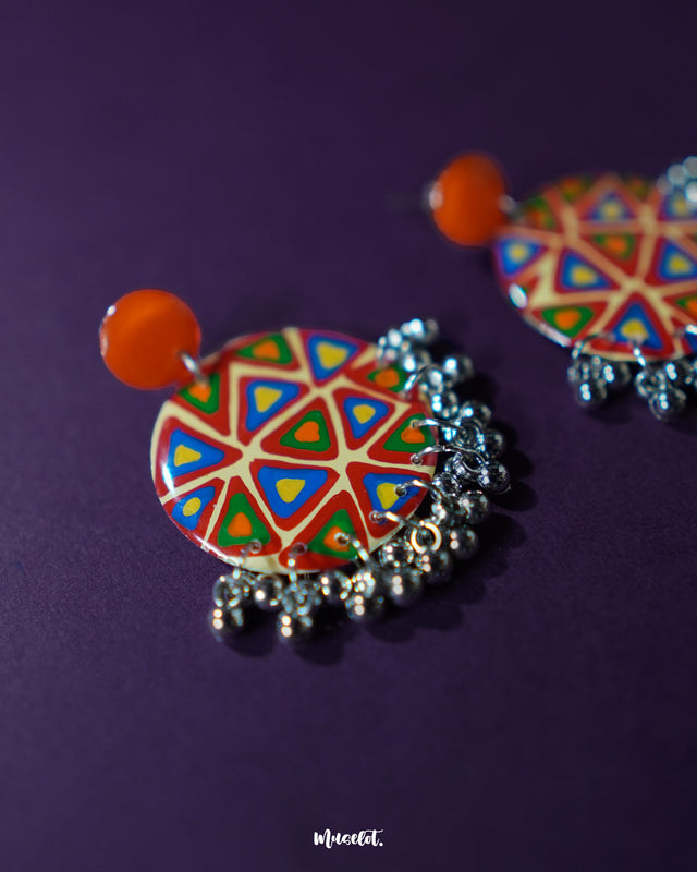 Multi-color Chakardi traditional earrings, showcased against a neutral backdrop, featuring vivid colors and intricate design details that bring a fusion of heritage and contemporary elegance — Muselot.