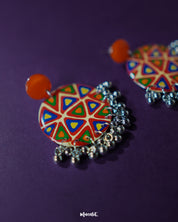 Multi-color Chakardi traditional earrings, displayed against a soft-toned backdrop, with vibrant colors and finely crafted patterns that capture the essence of traditional artistry with a modern touch — Muselot.