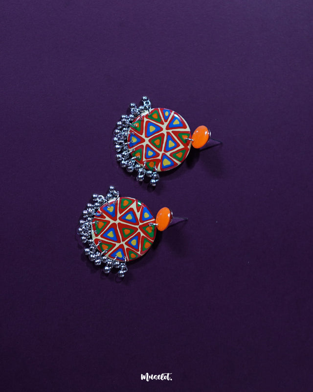 Chakardi traditional earrings, set against a gentle backdrop, featuring a harmonious blend of bright hues and intricate detailing that showcase the fusion of timeless craftsmanship and contemporary style — Muselot.