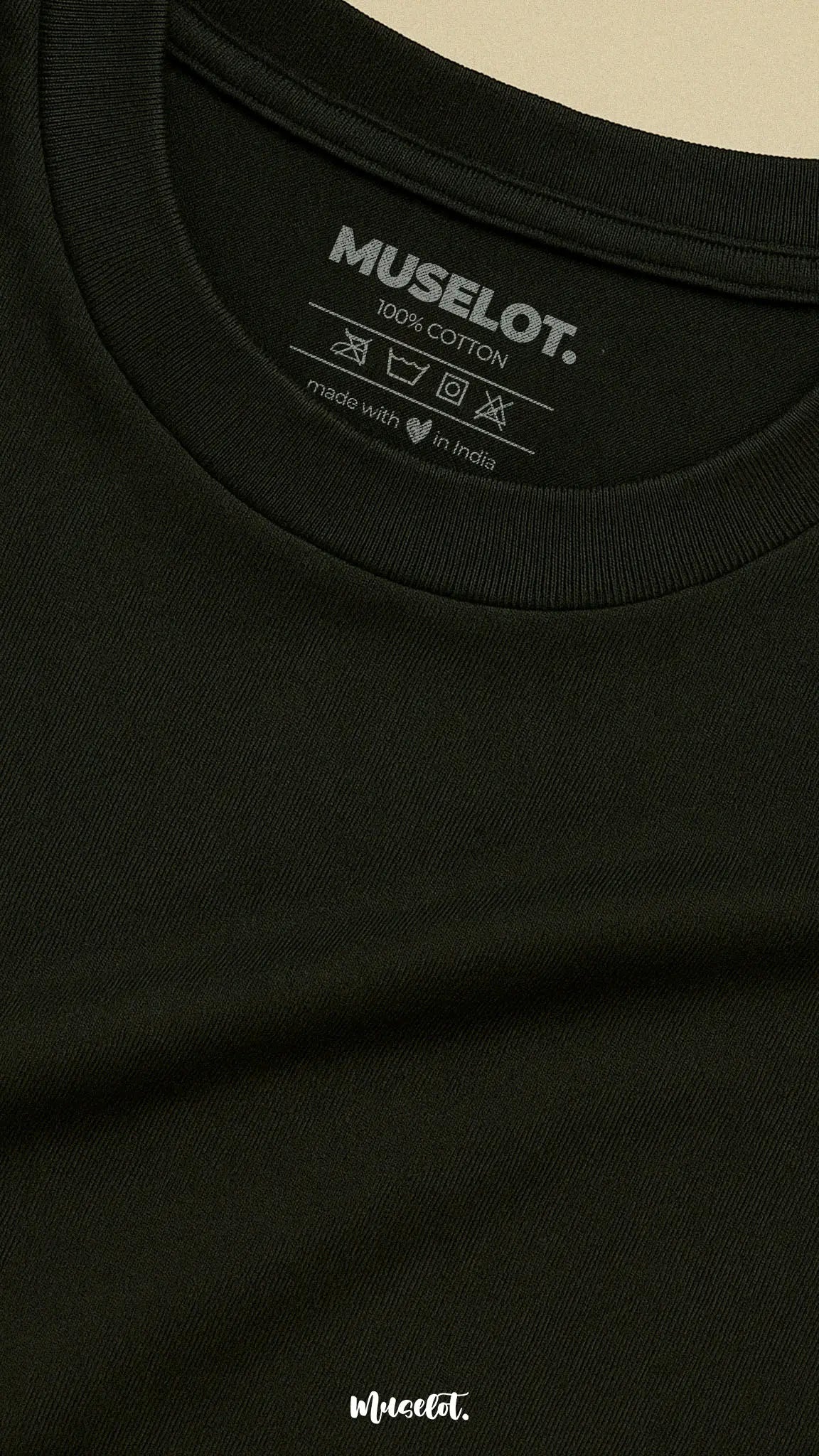Close-up shot of the neckline of a unisex cotton black t-shirt, showcasing the detailed stitching and subtle logo, emphasizing its premium design and quality craftsmanship-Muselot