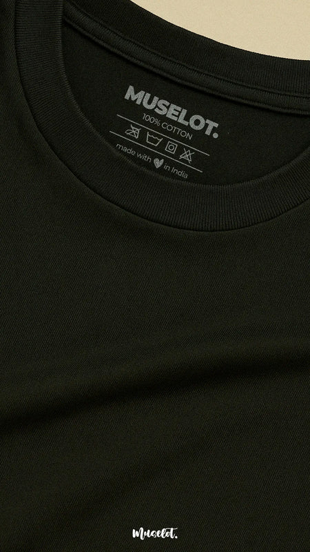 Close-up shot of the neckline of a unisex cotton black t-shirt, showcasing the detailed stitching and subtle logo, emphasizing its premium design and quality craftsmanship-Muselot