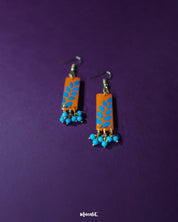 Narmshaam handmade hook earrings captured in a close-up shot on a neutral backdrop, showcasing the fine thread detailing and lightweight design that blends traditional craft with a modern, minimalist aesthetic — Muselot.