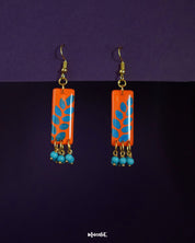 Narmshaam stud drop earrings featuring a dual-tone design with intricate floral accents, blending elegance and everyday charm, perfect for adding a graceful touch to any look — Muselot.