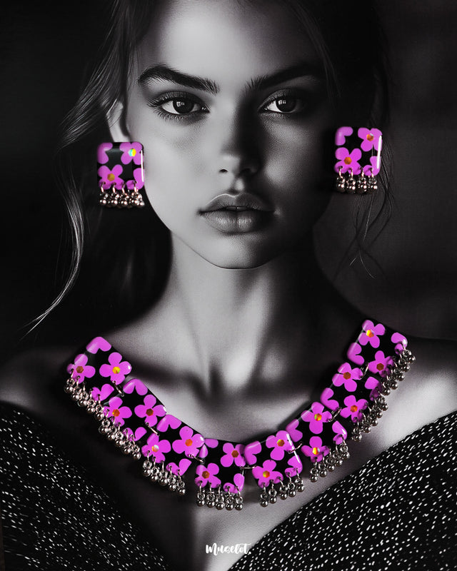 A stunning model showcases the Naubahar handmade floral necklace set, featuring delicate lavender flowers that elegantly rest against a purple backdrop. The intricate craftsmanship and charming design make this piece an ideal addition to any wardrobe, bringing a sophisticated and feminine touch — Muselot
