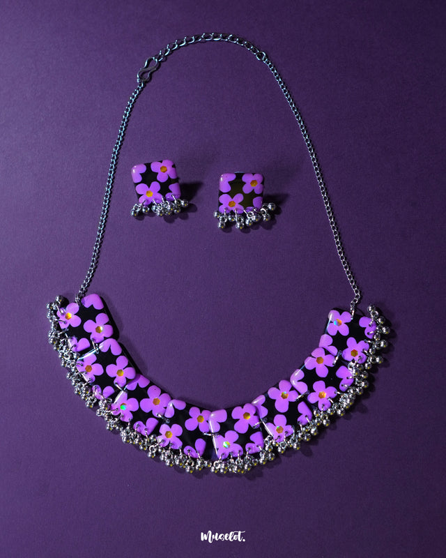 Naubahar purple necklace set adorned with delicate lavender flowers, set against a soft purple background, exuding an elegant blend of charm and sophistication — Muselot