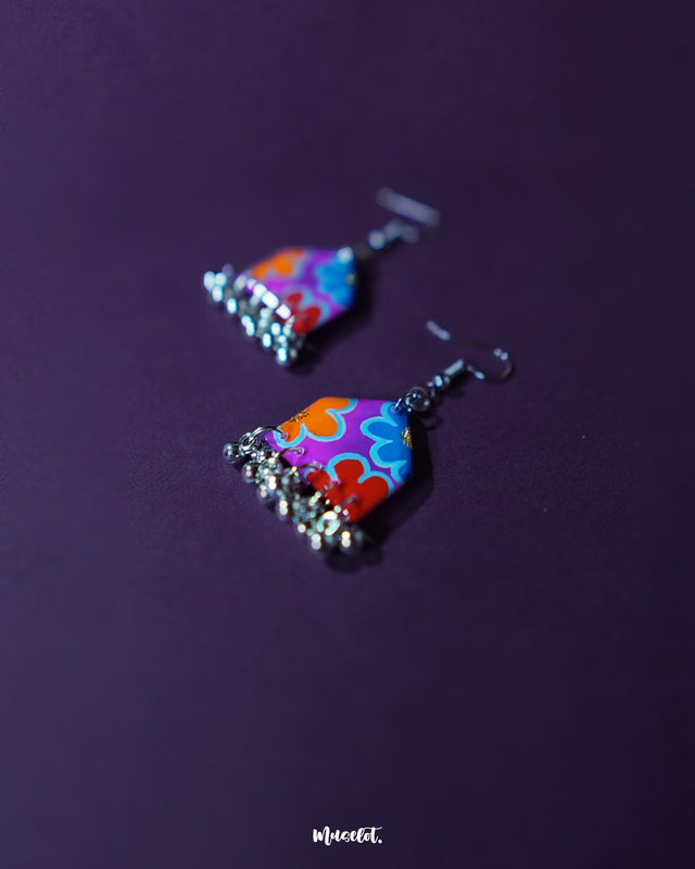 Side view of Nazrana multicolour floral earrings, showcasing layered hand-painted motifs and traditional ghungroo drops on a neutral background – Muselot.