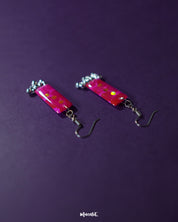 Noorasa drop earrings with a delicate shimmer, set against a deep background highlighting their refined craftsmanship and graceful allure – Muselot