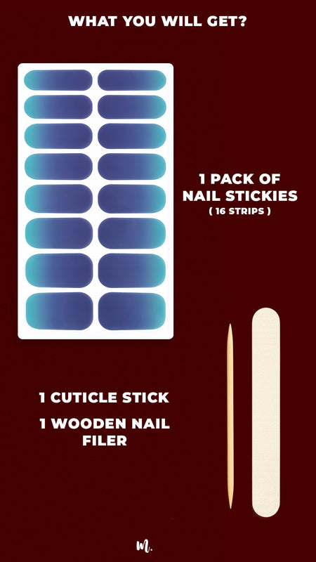 A neatly laid-out kit of Ocean Dip Ombre Nail Stickies, showcasing 16 gradient strips in deep navy to aqua teal tones, along with a wooden cuticle stick and nail filer, highlighting the complete set you receive for an easy, salon-like ombre manicure at home – Muselot.