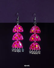 Parvaaz handmade pink drop earrings featuring a soft pink finish and delicate metallic danglers, highlighting their feminine charm and showcasing a playful, graceful style perfect for adding a pop of color to any outfit — Muselot.